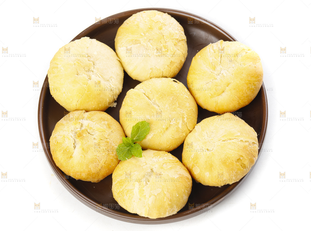白底上摆放着一堆苏式月饼